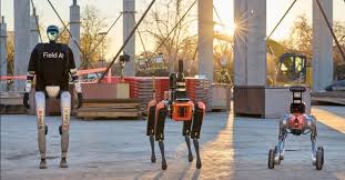 Three robots positioned in front of a building, symbolizing FieldAI's cutting-edge developments in robotic autonomy